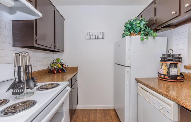 a stove top oven sitting inside of a kitchen