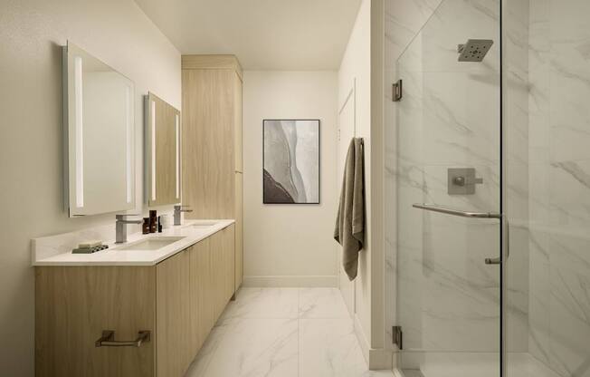 A bathroom with a white marble floor and a wooden vanity with two sinks.