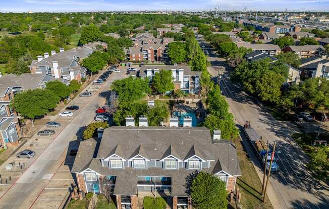 aerial shot of apartment complex trees