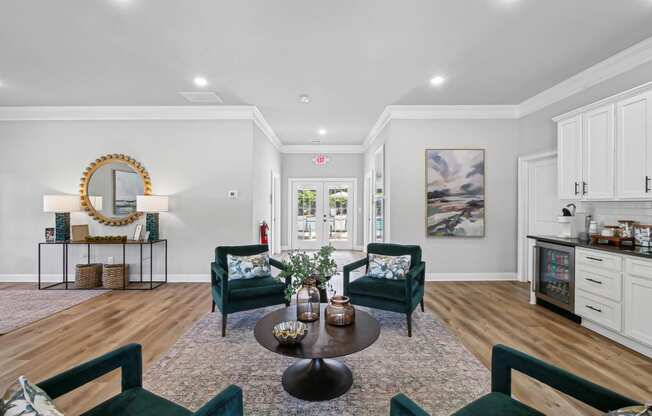 a living room with chairs and a table