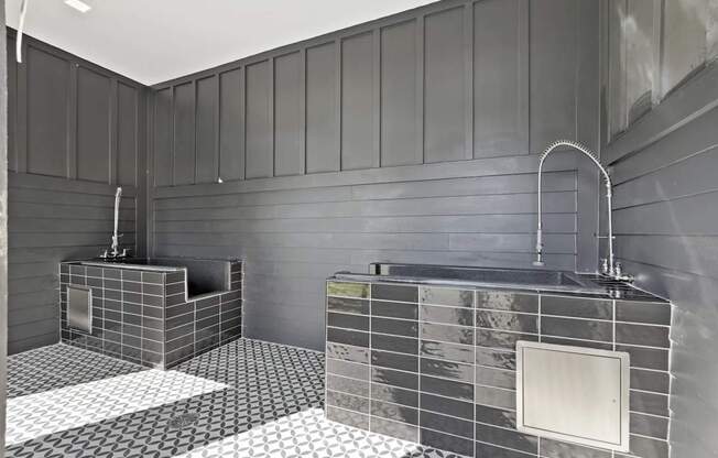 A bathroom with two sinks and a large mirror.