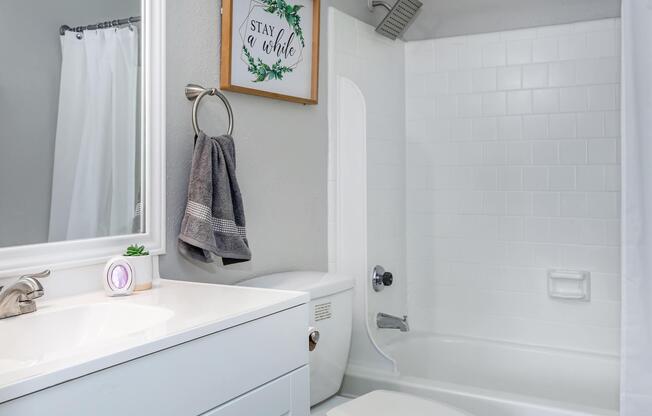 a room with a sink and a shower