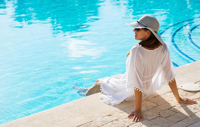 woman relaxing poolside.jpg