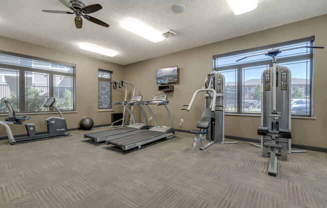 Fitness center with strength and cardio equipment at North Pointe Villas