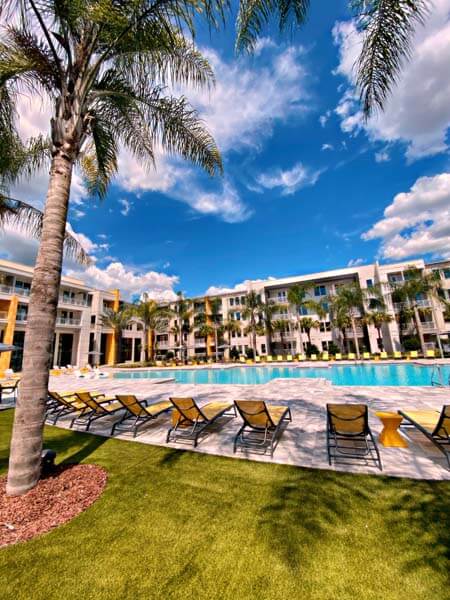 a swimming pool with a bunch of chairs next to it  at Fusion, Jacksonville, FL