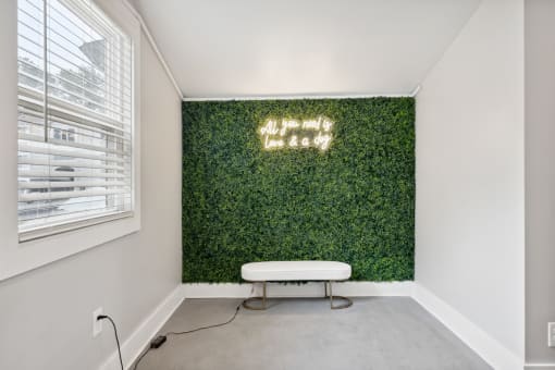 a living wall with a white bench in front of it at Linkhorn Bay Apartments, Virginia Beach, VA, 23451