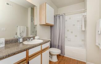 bathroom with white cabinets