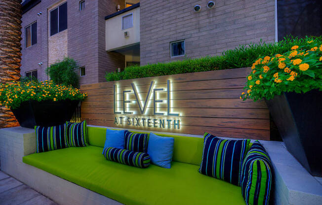 outdoor seating with level at sixteenth monument sign