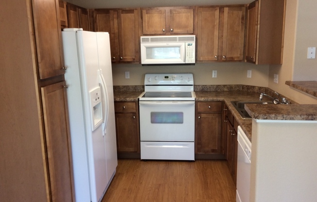 2 bedroom Condo in a gated community. 1 Car Garage &  1 Carport!!