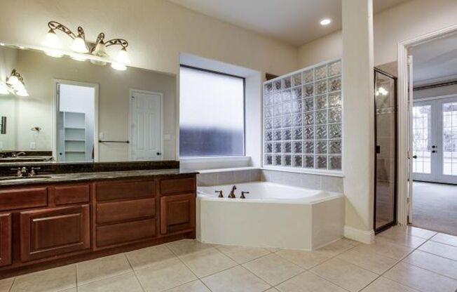 Bright and airy living room, fireplace, study, custom lighting in the formal living and dining.
