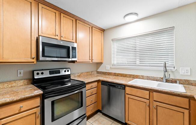 a kitchen with a stove top oven sitting inside of a microwave