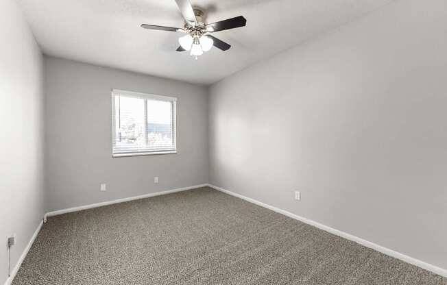 Pet-Friendly Apartments in Overland Park, KS - Treetop Lodge - Photo of Bedroom with Ceiling Fan