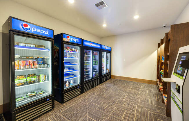 a convenience store with refrigerators and vending machines