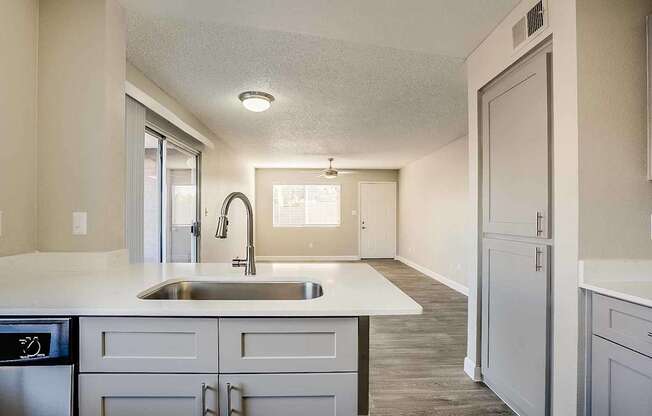 A kitchen with a sink and a window at Sterling Point Apartment Homes, Phoenix, AZ