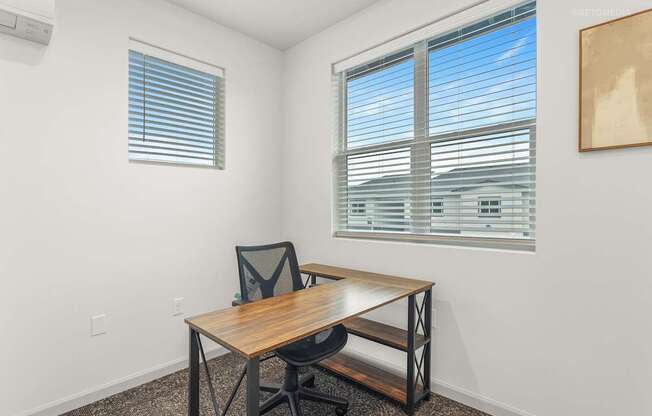 A room with a table and a chair.