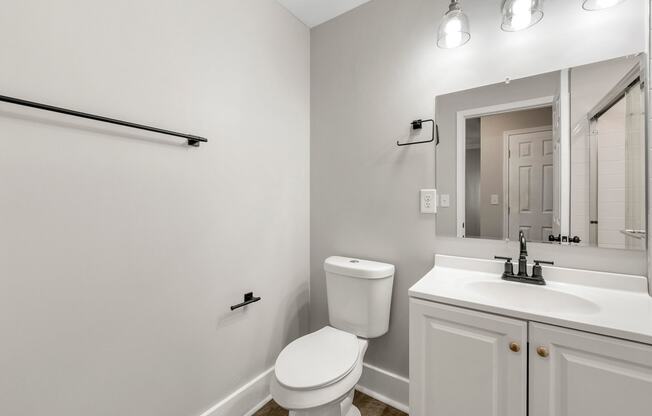 Bathroom with a toilet and a sink at Crogman School Lofts, Atlanta, 30315