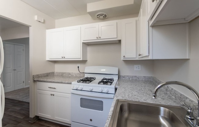 This is a photo of the kitchen in the 631 square foot, 1 bedroom/1 bath Montgomery floor plan at Colonial Ridge Apartments in the Pleasant Ridge neighborhood of Cincinnati, OH.