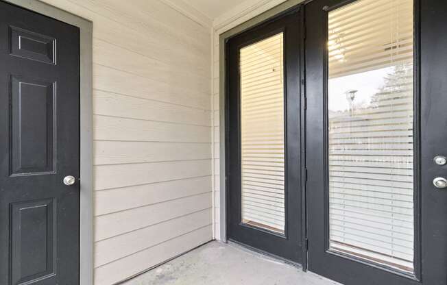the front door of a home with black doors