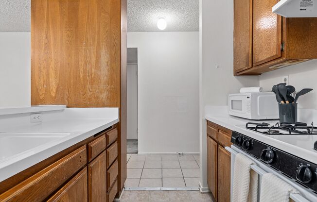 A 3 Bedroom apartment with Private & Common Bathrooms, common areas and a fully functional kitchen at 655 Kelton Ave.