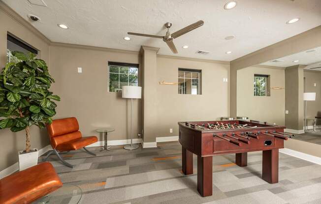 Clubroom with a foosball table at Woodbridge Villas Apartments, Sachse