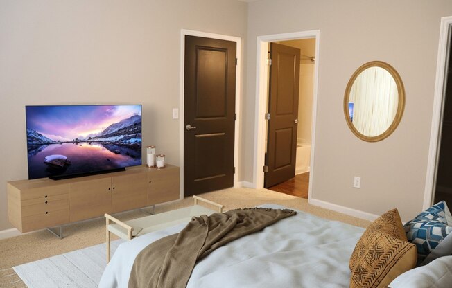 a bedroom with a bed and a tv in it