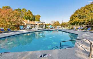 A pool with a 3 feet sign on the edge.