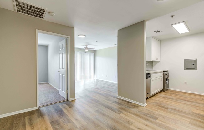 living room with vinyl wood flooring and ceiling fan at at Cypress Villas Apartments