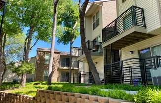 This is a photo of building exteriors/grounds at Canyon Creek Apartments in Dallas, TX.