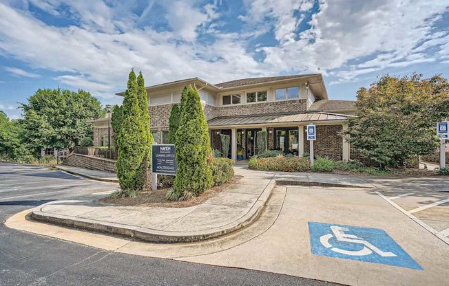 A building with a parking space in front of it.