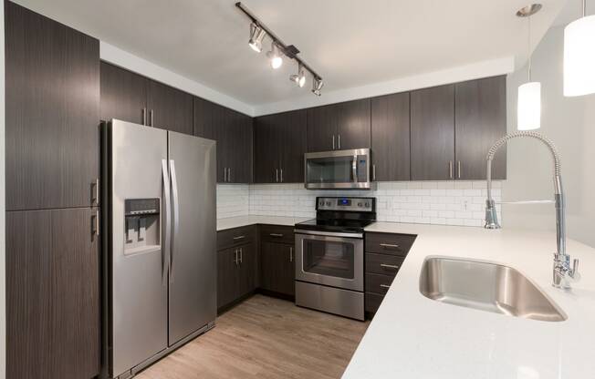 Stainless Steel Appliances And Modern Cabinetry At Union at Roosevelt Apartments In Phoenix, AZ