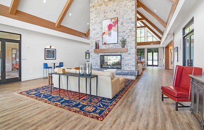 a living room with a fireplace and a rug