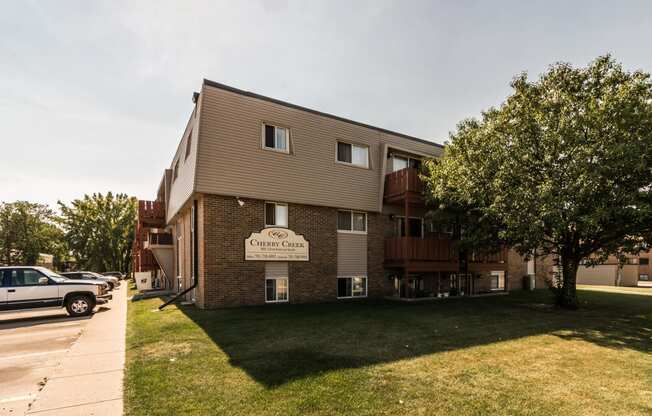 Grand Forks, ND Cherry Creek Apartments. Exterior with trees