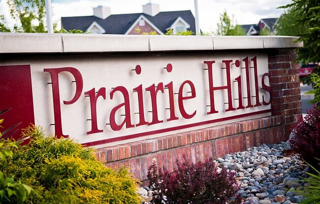 a red and white sign that says prairie hills