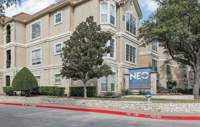 A building with the sign NEO in front of it.