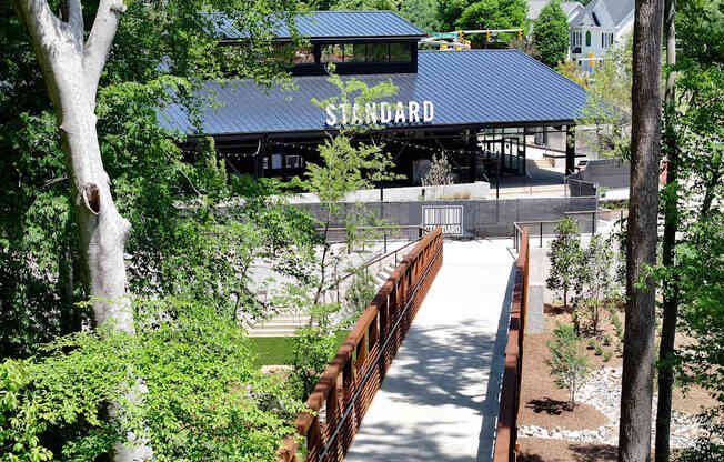 A building with a blue roof and the word "STANDARD" on it.