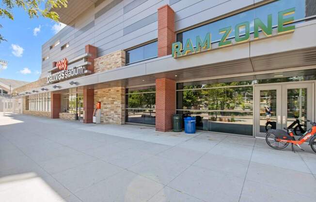 A Ram Zone storefront with a bicycle parked outside.