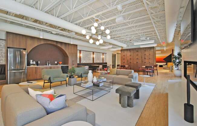 a living room with couches and chairs and a table