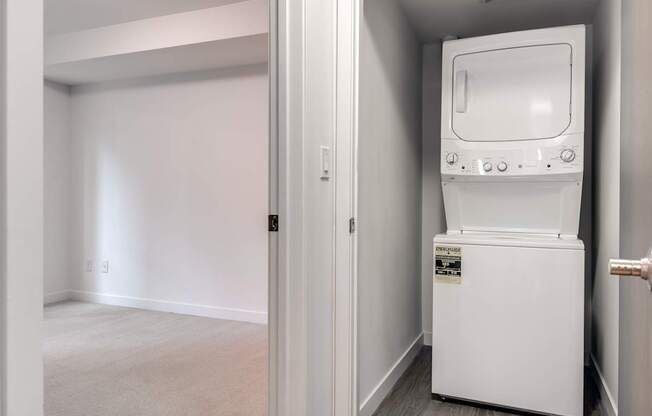 A white oven is in a small room.