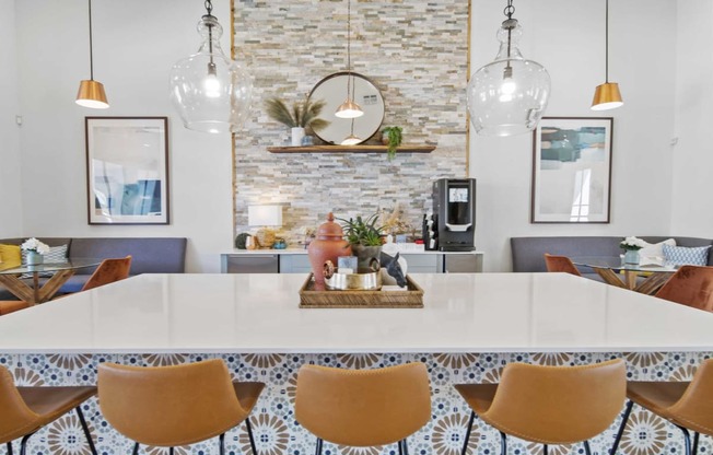 a dining room with a white table and chairs