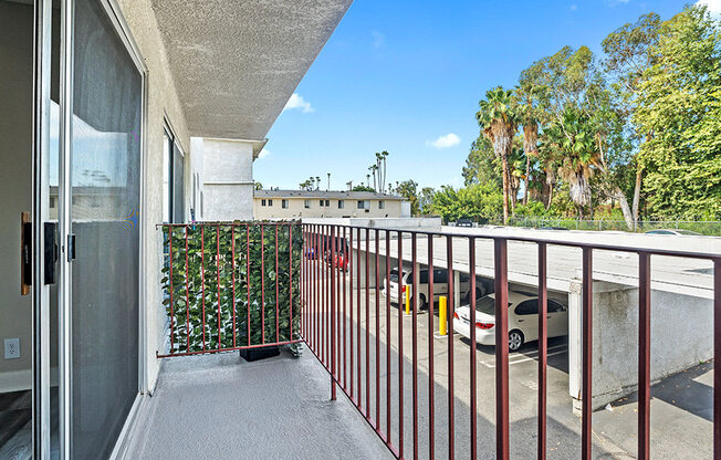 Private balcony overlooking covered parking area.