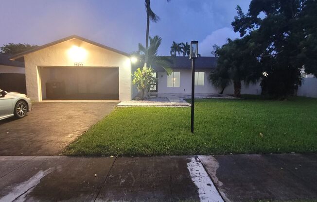 3 Bed/2 Bath pool home with 2 car garage on a quiet street near The Hammocks.