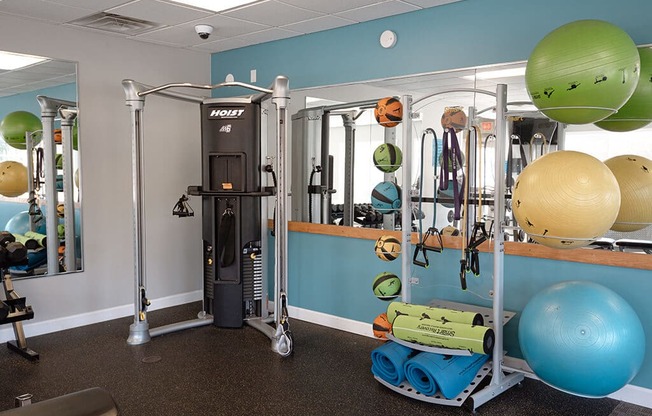 a gym with weights and equipment in a fitness room