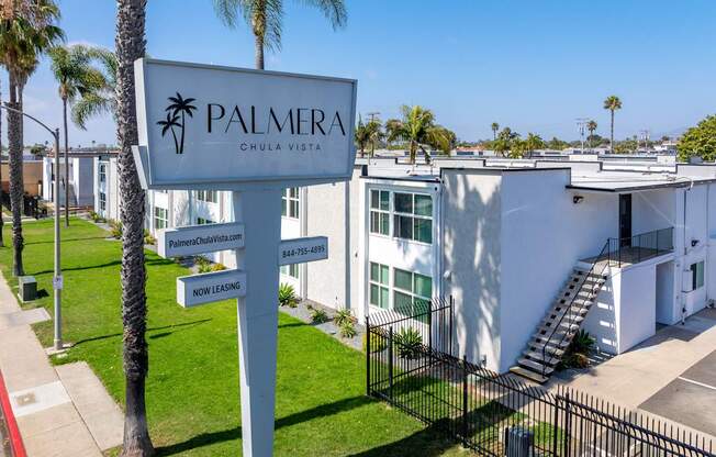 Palmera Chula Vista sign in front of a white building.
