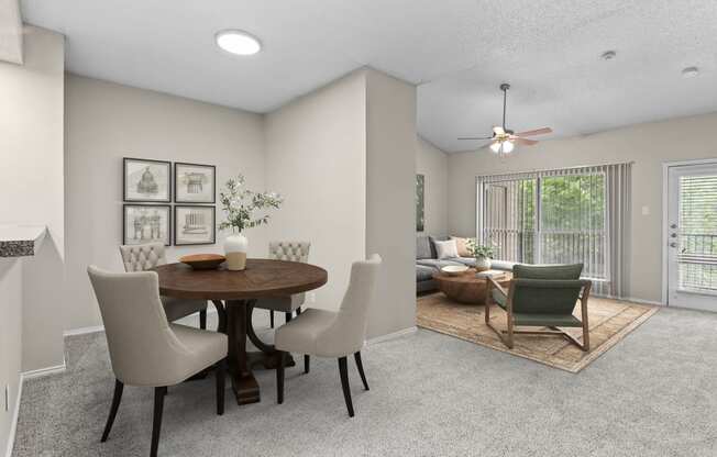 an open living room and dining room with a table and chairs