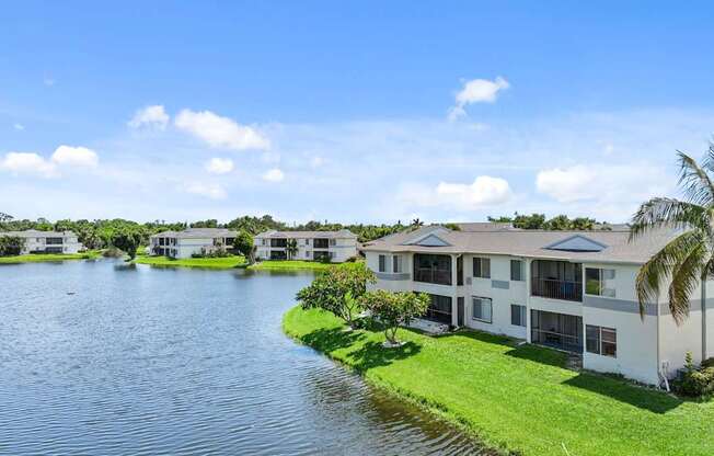 a group of houses next to a body of water