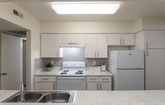 This is a photo of the kitchen of the 991 square foot 2 bedroom, 2 bath apartment at The Biltmore Apartments located in the Vickery Meadow neighborhood of Dallas, TX.