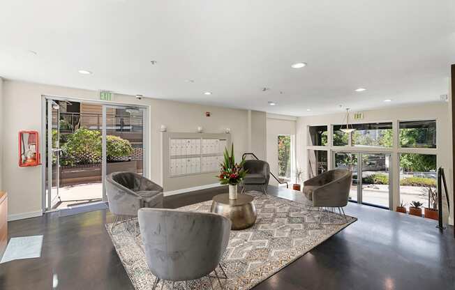 Resident Lounge Lobby filled with comfortable seating and large windows for an open concept space at Illumina Apartment Homes, Seattle