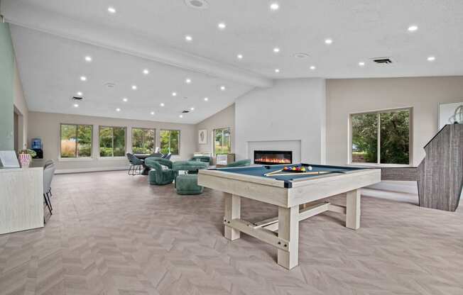 a game room with a pool table and a fireplace at Edge At Farmington Hills - Farmington Hills, MI, Michigan, 48334