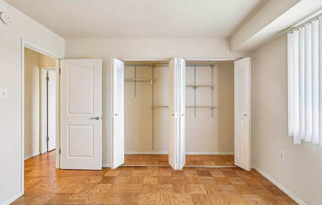 A room with a wooden floor and white walls.