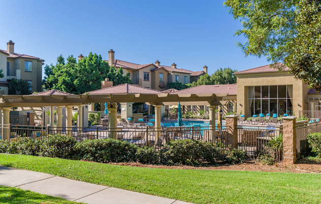 A sunny day at the poolside with a clear blue sky.